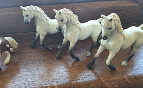 One white plastic horse - one,